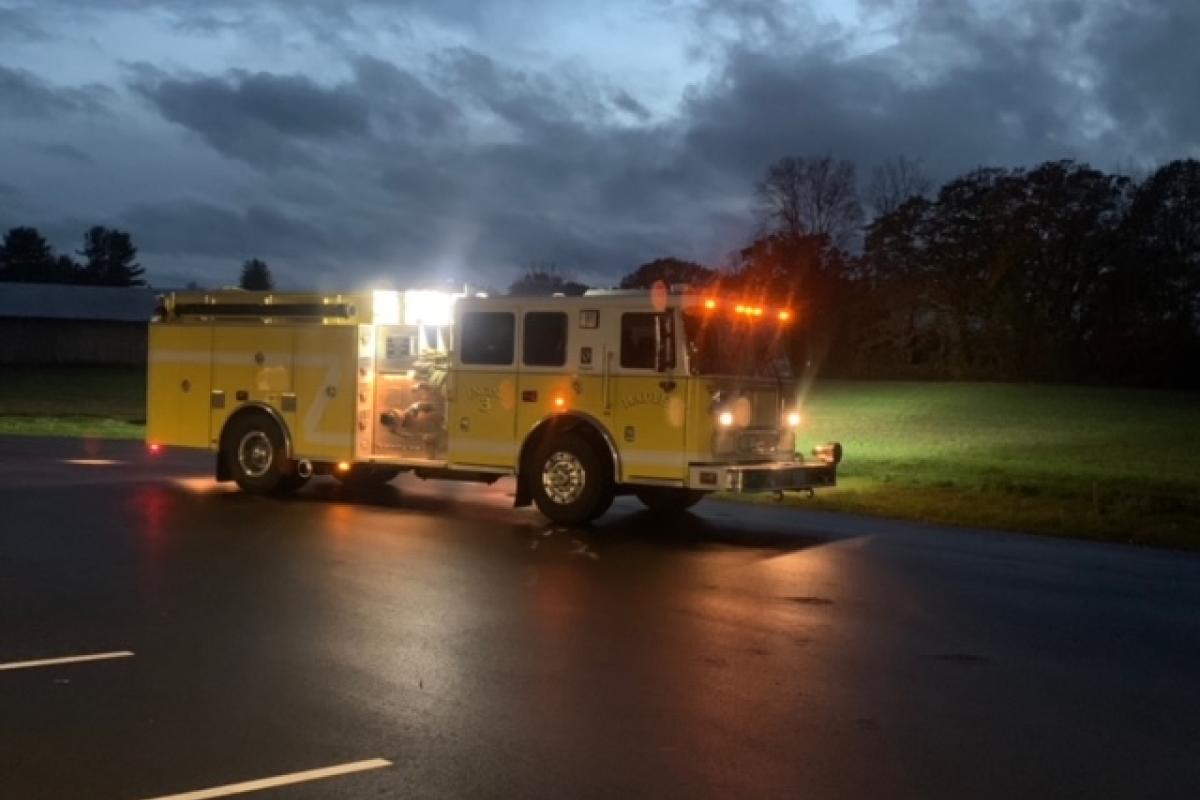 Hadley Fire Department's Engine 3 2006 Seagrave Marauder II Pumper, all lights on, with cloudy and dark background