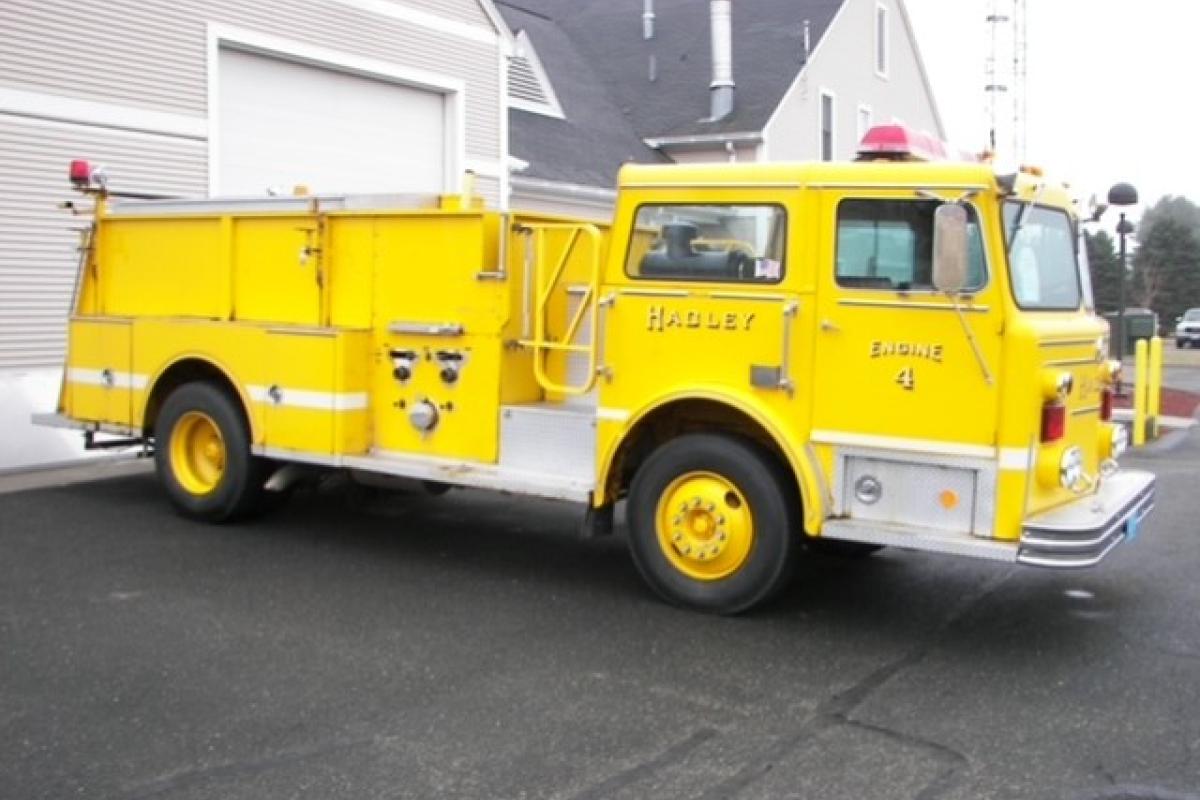 Yellow Hadley Fire Department's Engine 3 2006 Seagrave Marauder II Pumper, front angle of entire side of passenger side
